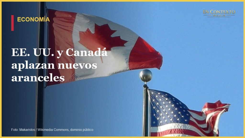 Las banderas de Estados Unidos y Canadá ondean una junto a la otra.