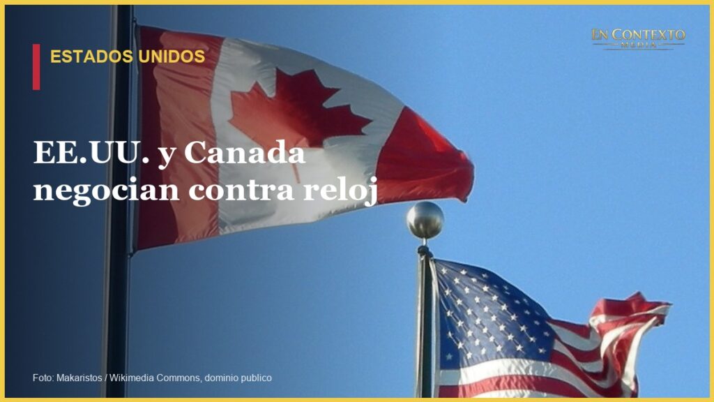 Banderas de Canada y Estados Unidos ondean una junto a la otra.